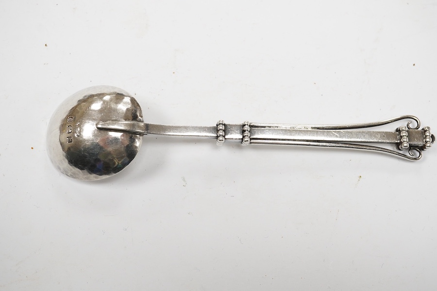 An Edwardian Arts & Crafts silver spoon, by Albert Edward Jones, Birmingham, 1907, 14.3cm. Condition - fair